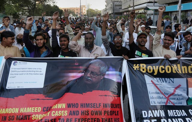 Angry Islamists chant slogans during a demonstration against the Pakistani newspaper Dawn, outside the Press Club in Karachi on Tuesday