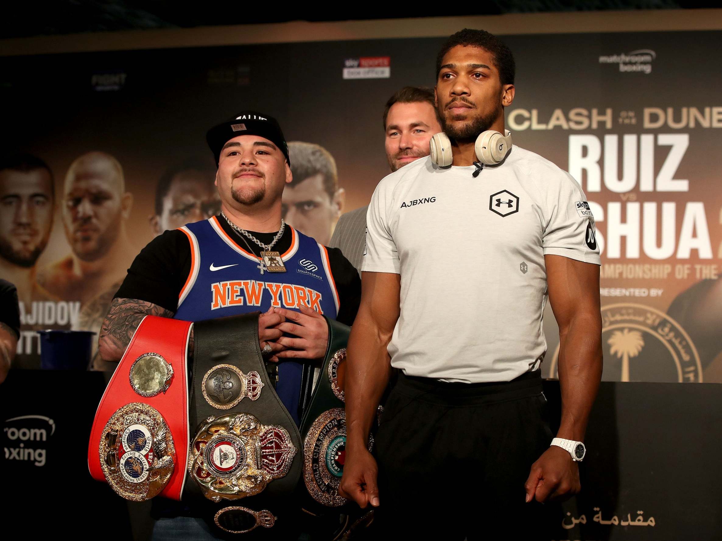 Ruiz poses with his belts alongside Joshua