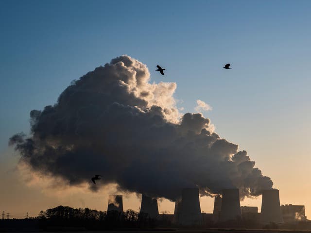 Smoke and vapor rising from the cooling towers and chimneys of the lignite-fired Jaenschwalde Power Station, eastern Germany