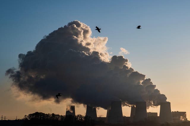 Smoke and vapor rising from the cooling towers and chimneys of the lignite-fired Jaenschwalde Power Station, eastern Germany