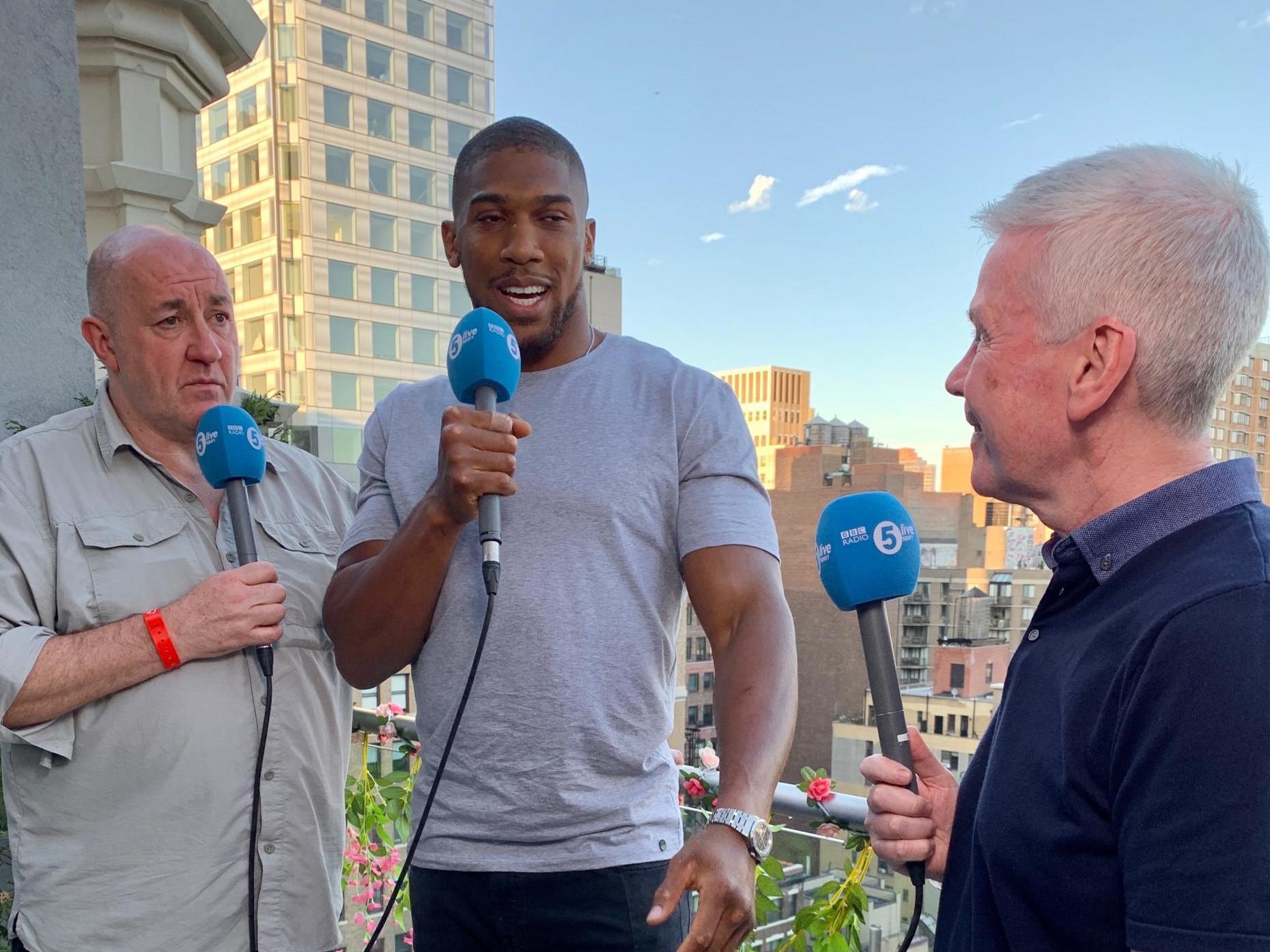 Steve Bunce and Mike Costello with Anthony Joshua in May of this year