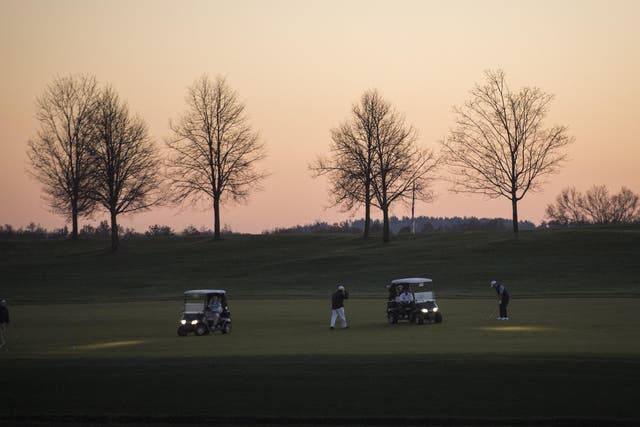 People play golf at Trump National Golf Club Bedminster