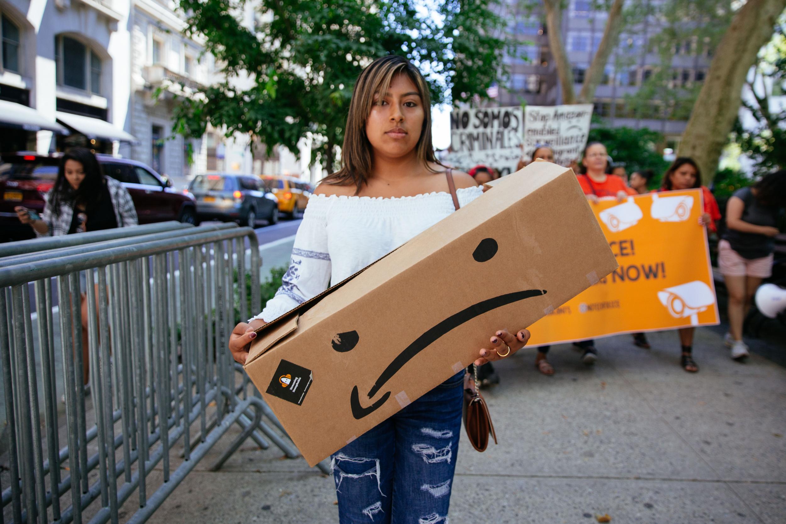 Protesters raise awareness of Amazon facilitating ICE surveillance efforts in New York City in July 2015 (Getty)