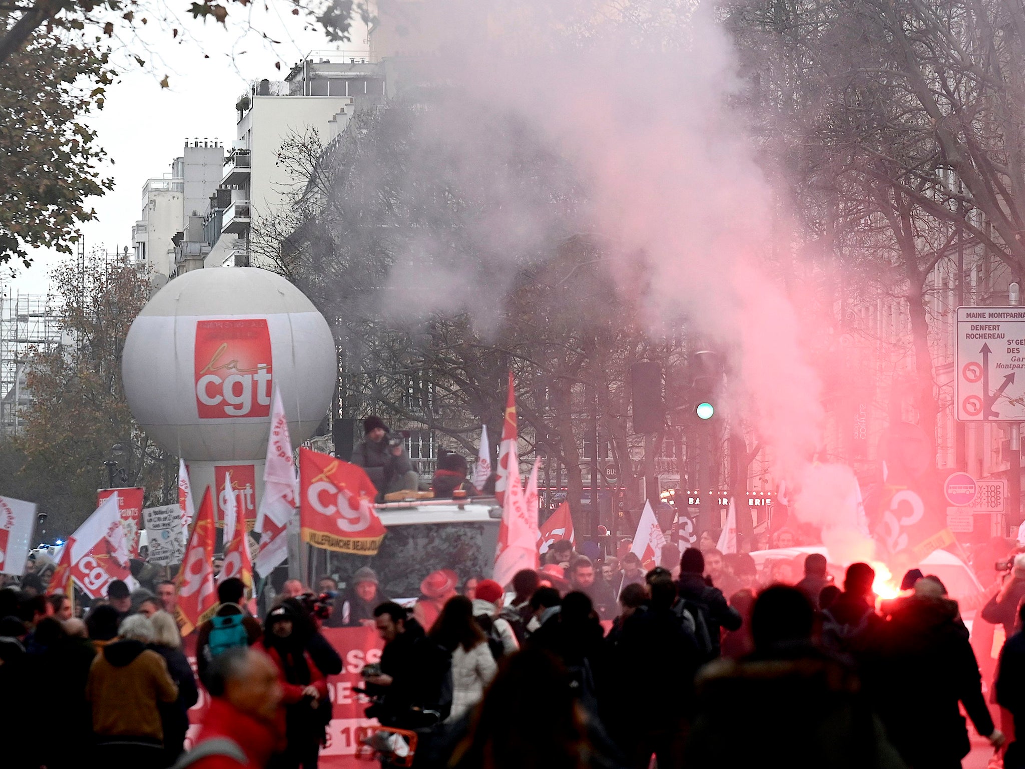 French unionists demonstrate against pension changes and rising unemployment