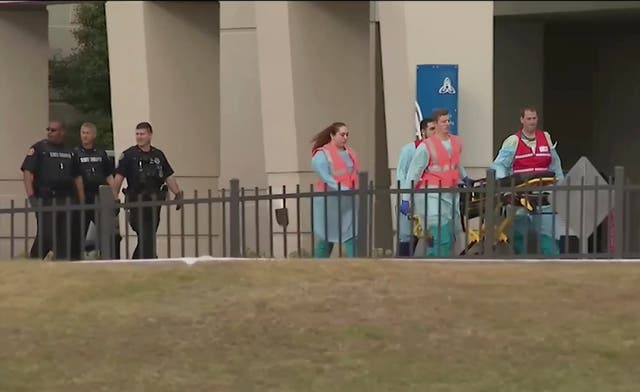 Emergency responders at the naval airbase at Pensacolo, Florida, following a shooting spree that left three people and the gunman, a Saudi trainee pilot, dead