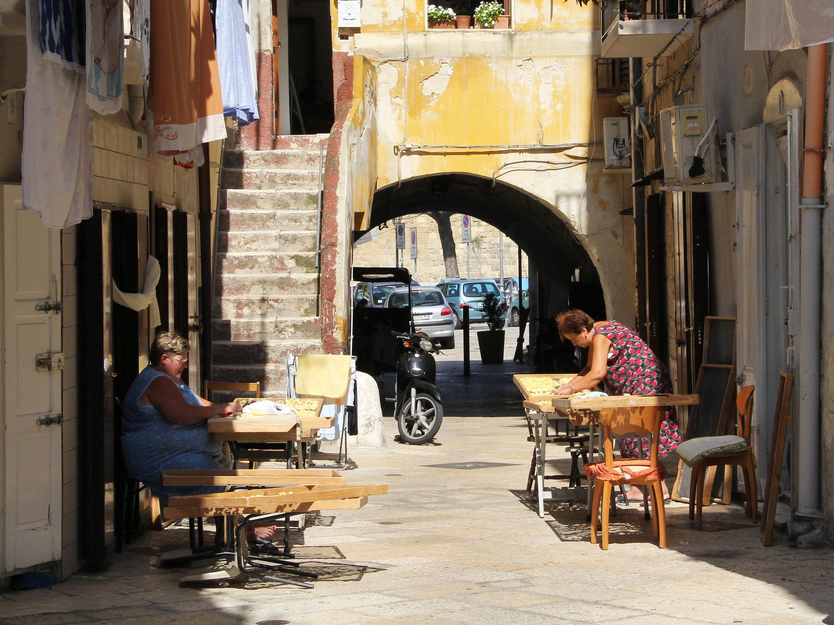 Pasta makers work out in the sun on Arco Basso in Old Bari