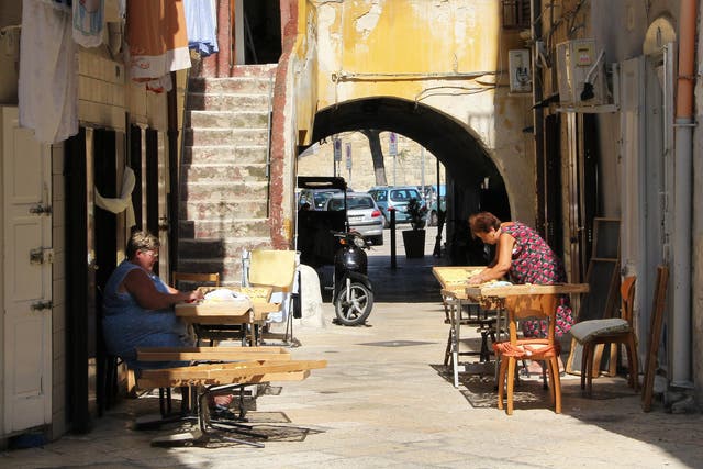 Pasta makers work out in the sun on Arco Basso in Old Bari
