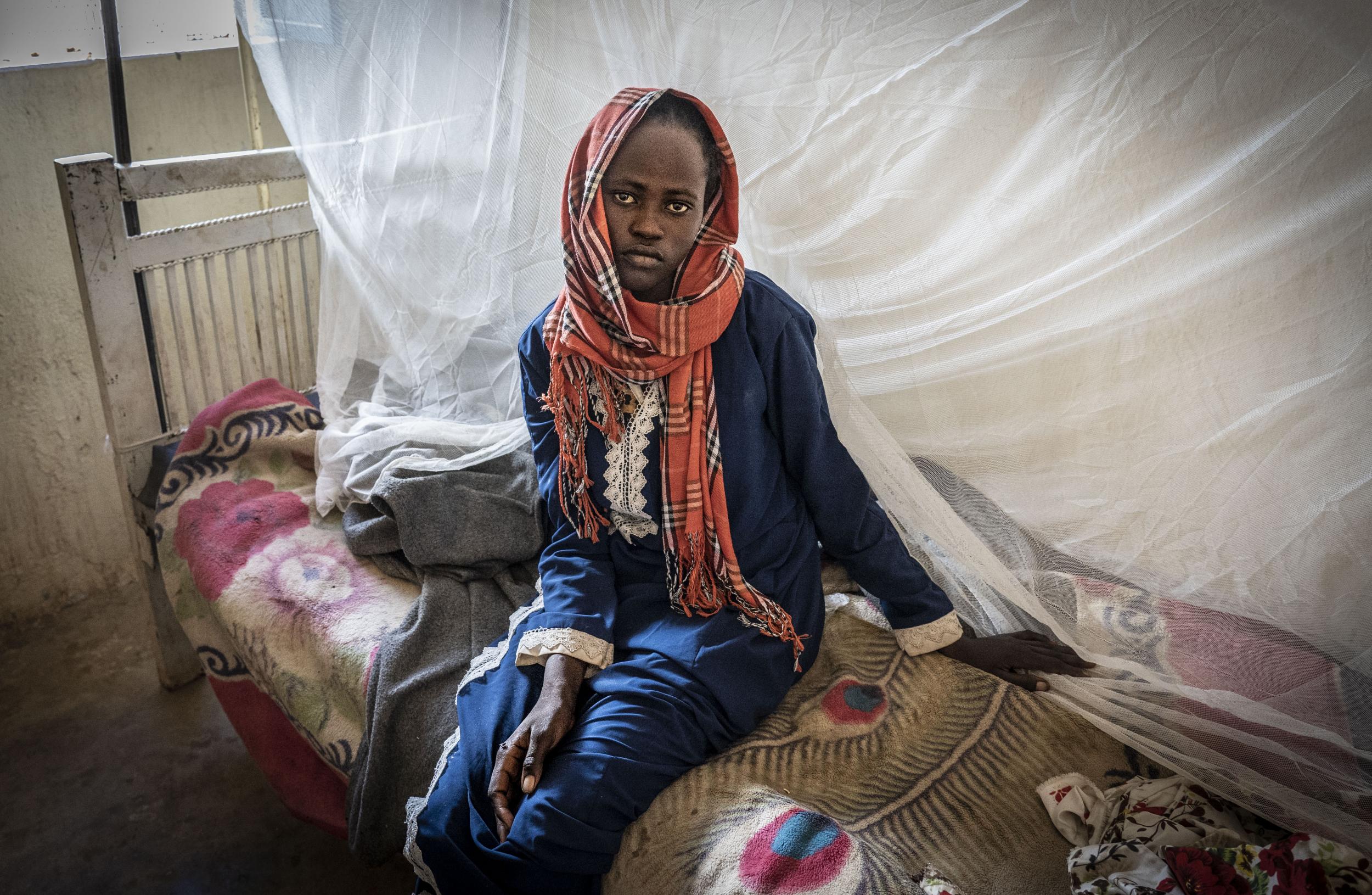 Akram is treated for malaria in Zamzam camp amid an outbreak of the disease in North Darfur