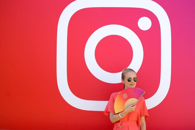 A visitor stands in front of the Instagram stand during day two of Dubai Lynx 2019