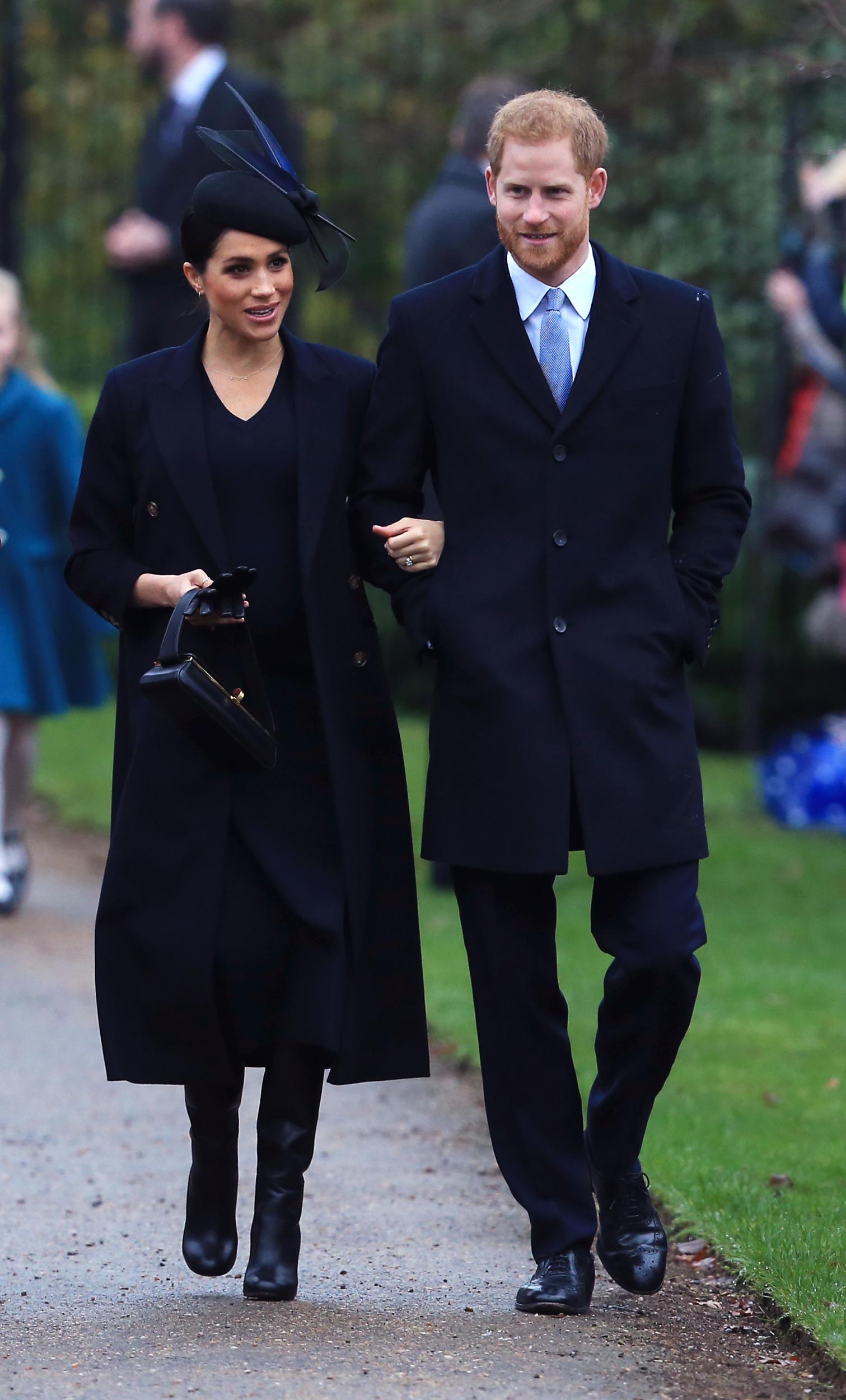 The Duke and Duchess of Sussex arrive to attend the Christmas Day church service at Church of St Mary Magdalene on the Sandringham estate on 25 December 2018