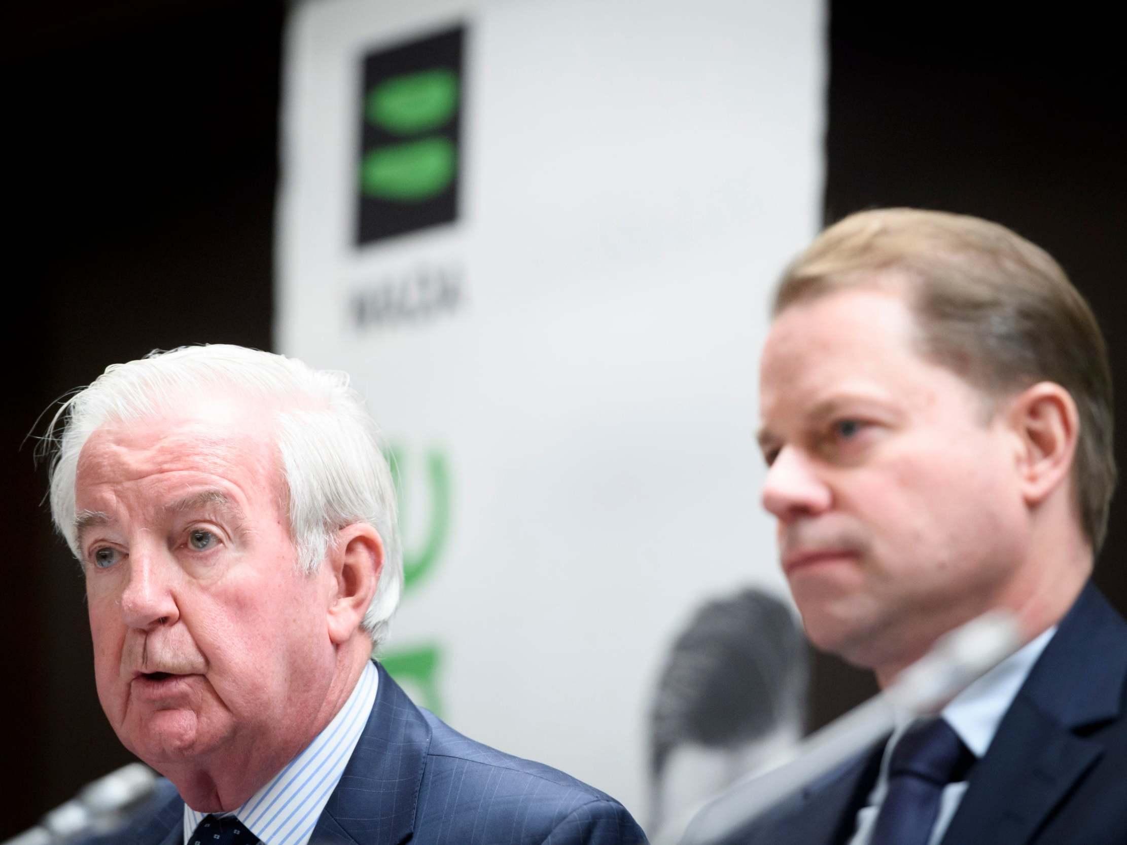 Wada president Craig Reedie, left, and director general Olivier Niggli speak during a press conference announcing Russia's ban