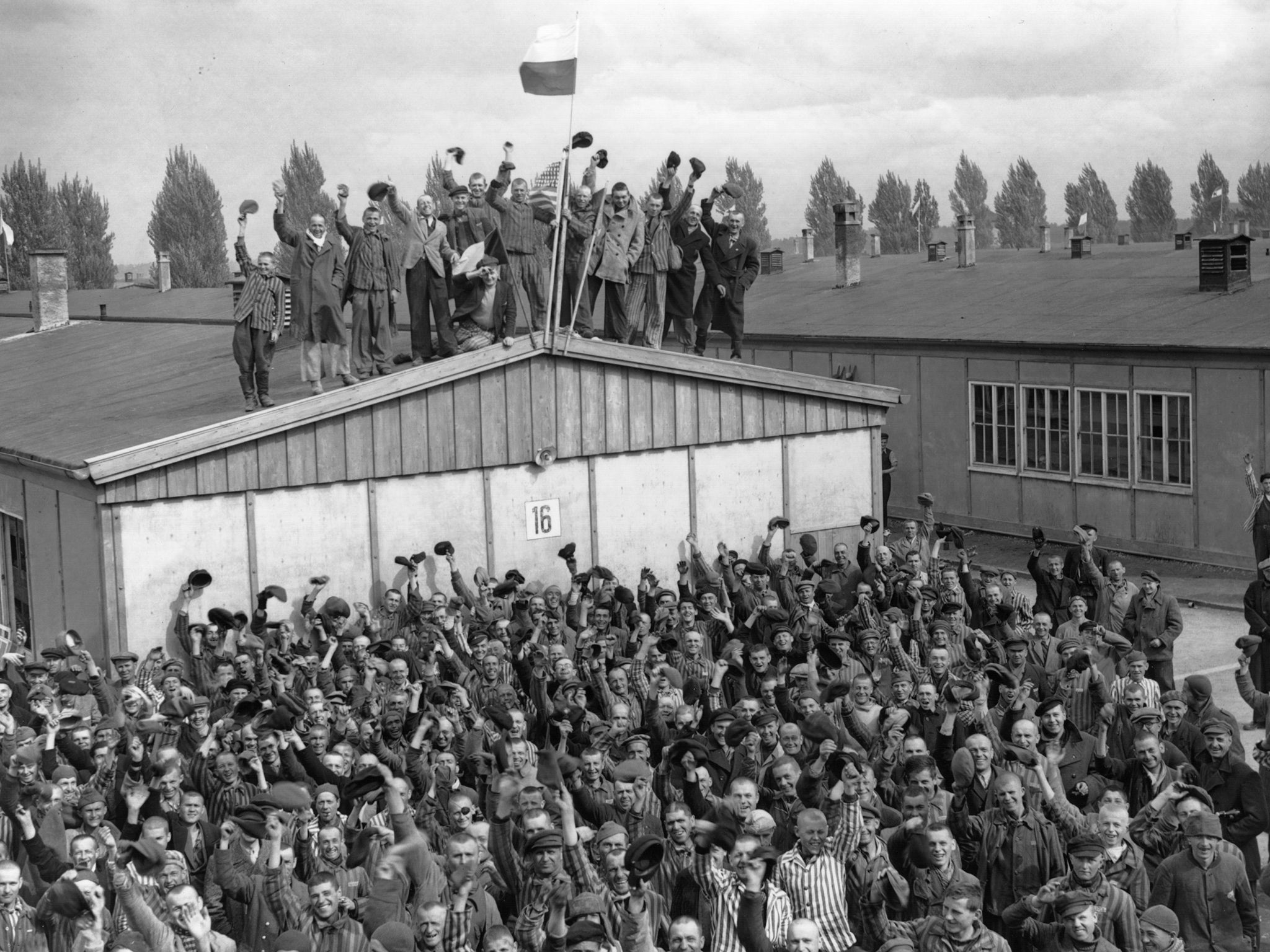 Prisoners at Dachau celebrate their liberation following the arrival of the US army