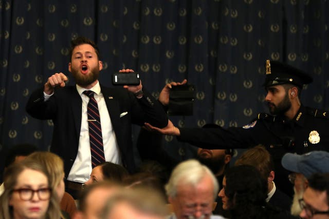Owen Shroyer, an Infowars host, disrupts the House Judiciary Committee hearing on the impeachment of Donald Trump before being escorted out by police