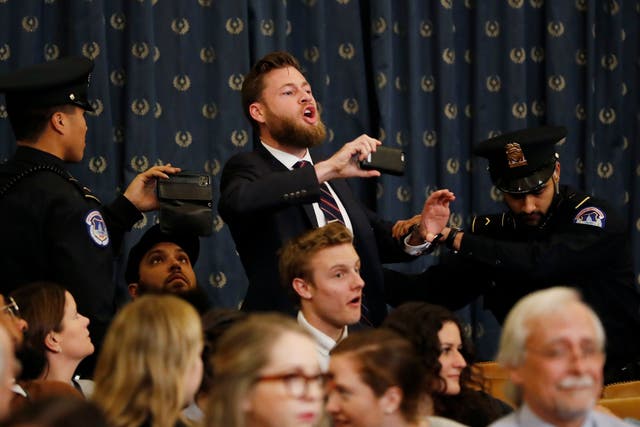 Owen Shroyer, an Infowars host, disrupts the beginning of a House Judiciary Committee impeachment hearing before being removed from police