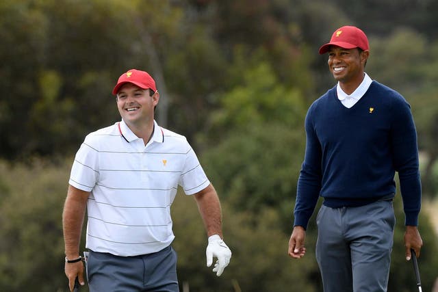 Tiger Woods and Patrick Reed play a practice round for the Presidents Cup