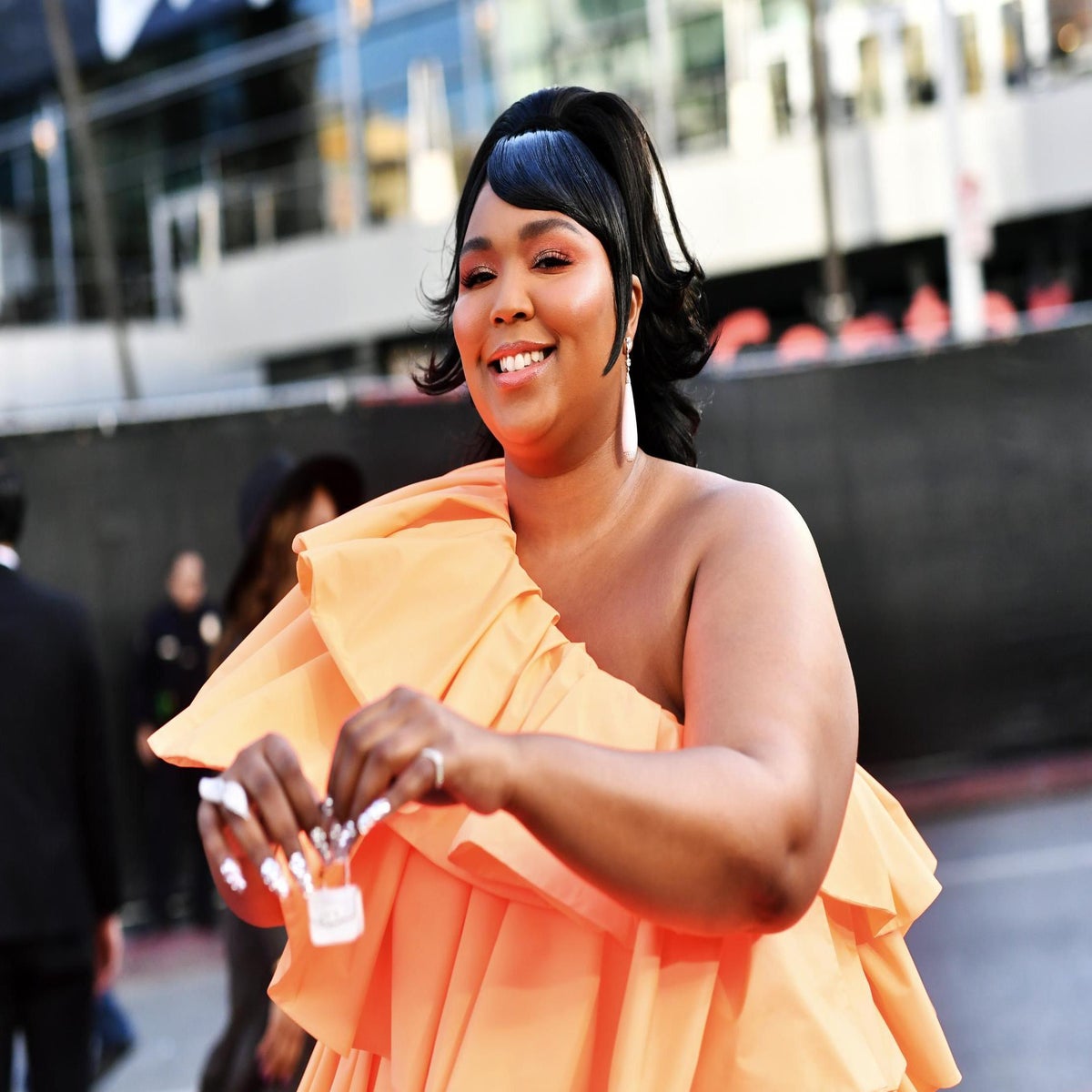 Lizzo's thong outfit at basketball game sparks debate about 'fatphobic'  body standards | The Independent | The Independent