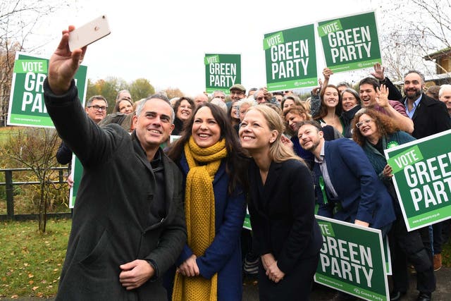 Green Party Co-Leader Jonathan Bartley (L) Deputy leader Amelia Womack (C) and Co-Leader Sian Berry (R) pose with party candidates at the Observatory, London Wetlands Centre, for the launch of the Green Party manifesto.