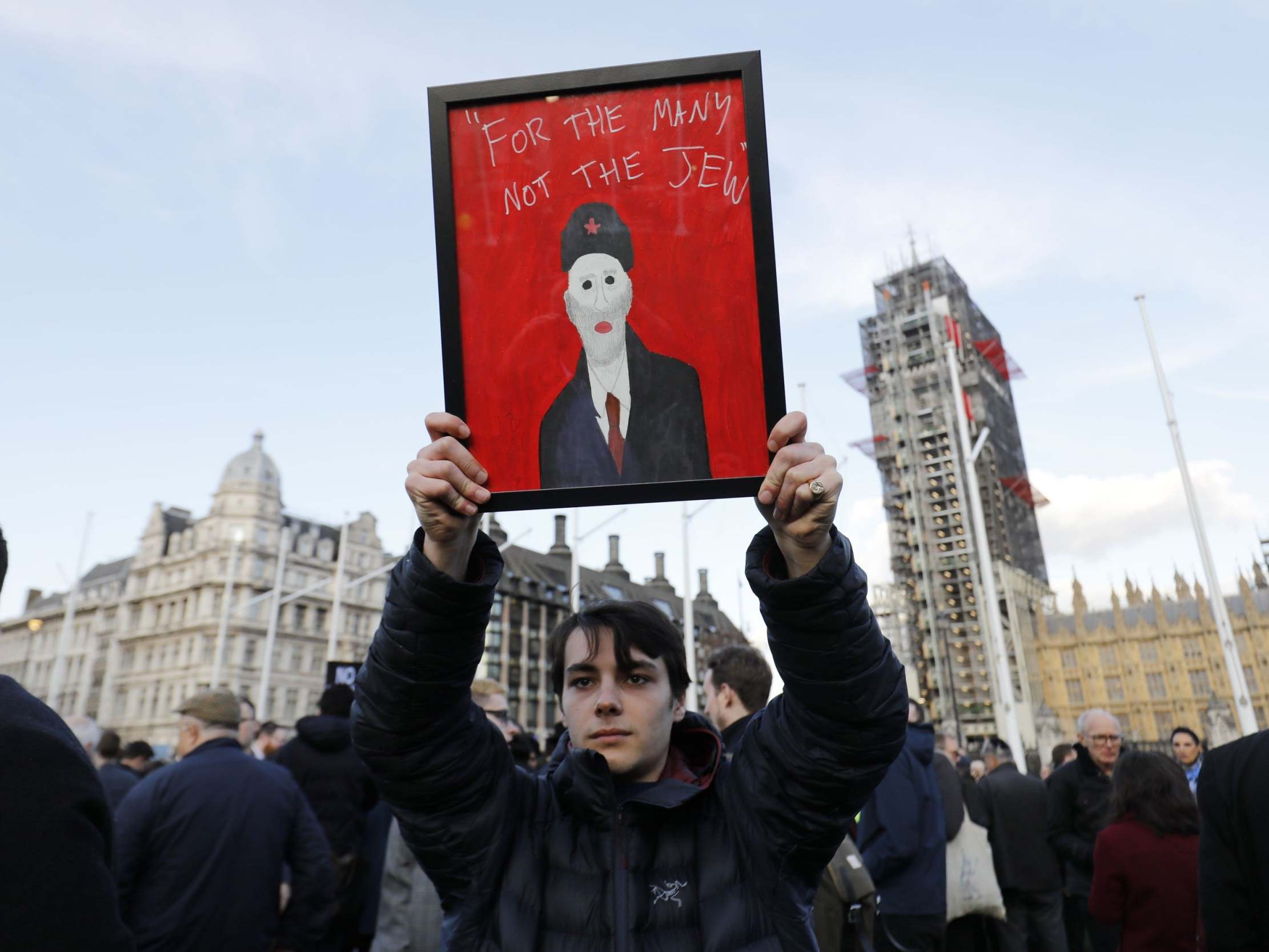Members of the Jewish community hold a protest against antisemitism in the Labour party outside the Houses of Parliament on March 26, 2018.