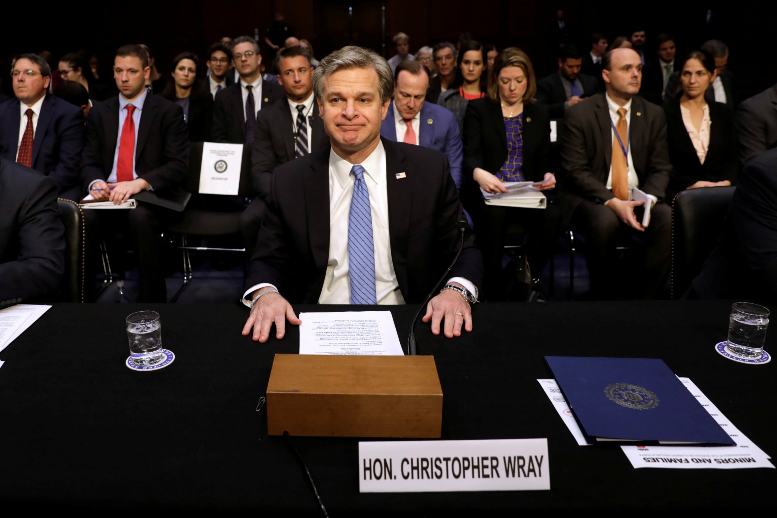 FBI director Christopher Wray prepares to give evidence to a Senate Homeland Security committee hearing