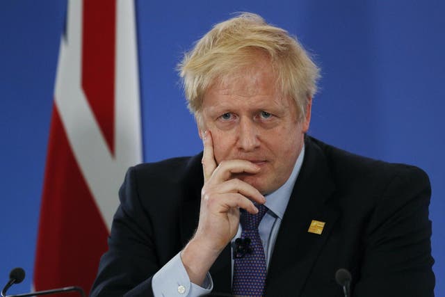 Britain's Prime Minister Boris Johnson gives a press conference at the NATO summit at the Grove hotel on December 4, 2019 in Watford, England