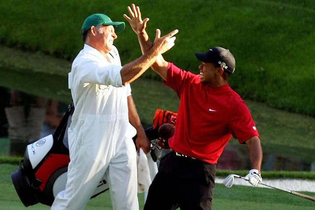 Tiger Woods and his caddie, Steve Williams, celebrate the chip