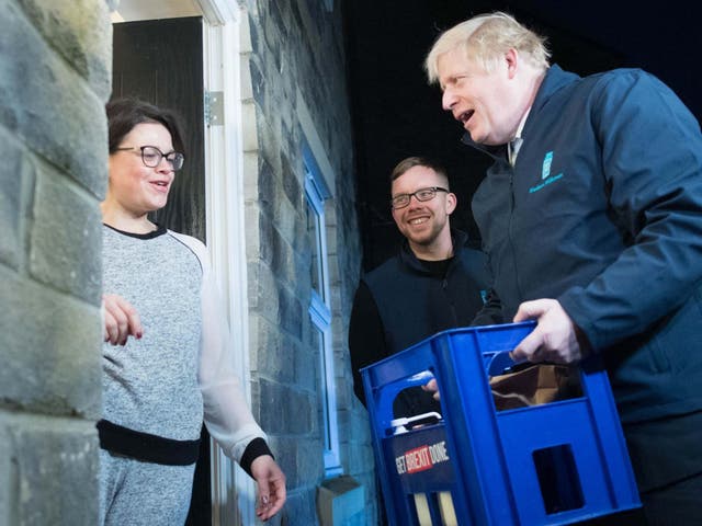 Prime Minister Boris Johnson delivers milk to Debbie Monaghan in Guiseley, Leeds