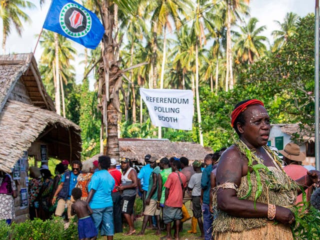 People queue to vote in Bougainville's independence referendum at a polling station in the capital Buka
