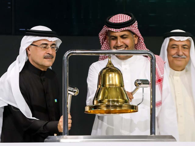 President and CEO of Saudi Aramco Amin Nasser (L) ringing the bell during a ceremony marking the debut of Saudi Aramco's initial public offering (IPO) on the Saudi Stock Exchange in Riyadh, Saudi Arabia.