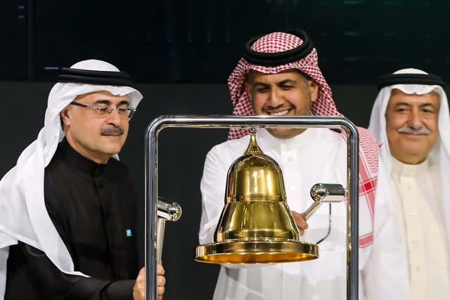 President and CEO of Saudi Aramco Amin Nasser (L) ringing the bell during a ceremony marking the debut of Saudi Aramco's initial public offering (IPO) on the Saudi Stock Exchange in Riyadh, Saudi Arabia.