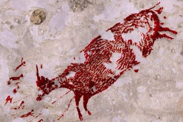A wild pig being hunted in the cave paintings in Sulawesi
