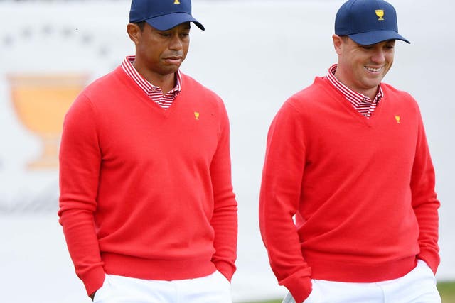 Tiger Woods and Justin Thomas recorded the USA's only point on day one of the Presidents Cup