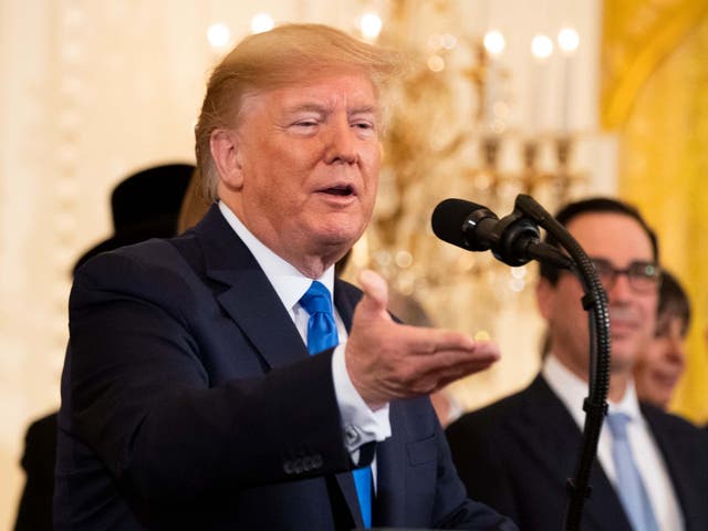 President Trump speaks during a Hanukkah reception in the East Room of the White House on 11 December 2019