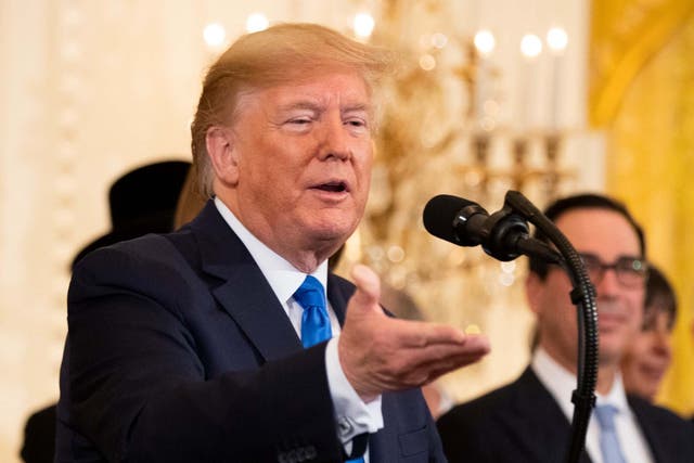 President Trump speaks during a Hanukkah reception in the East Room of the White House on 11 December 2019