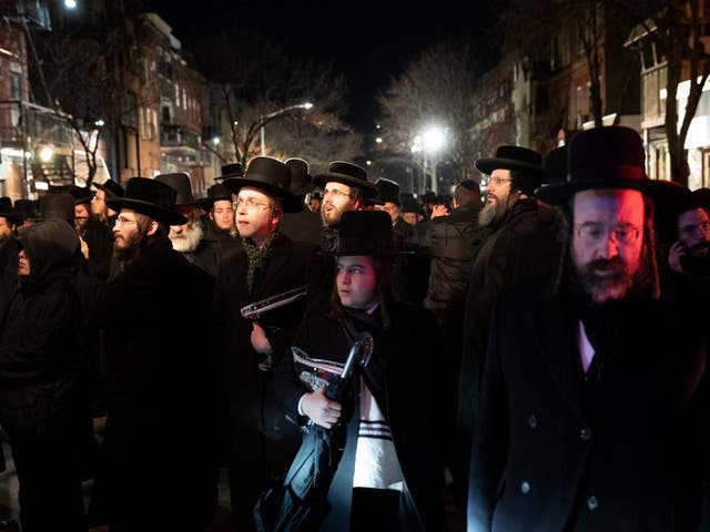Jewish mourners come together following the Tuesday shooting in Jersey City