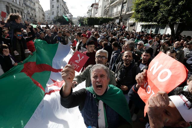 Algerian demonstrators take to the streets in the capital Algiers to reject the presidential elections
