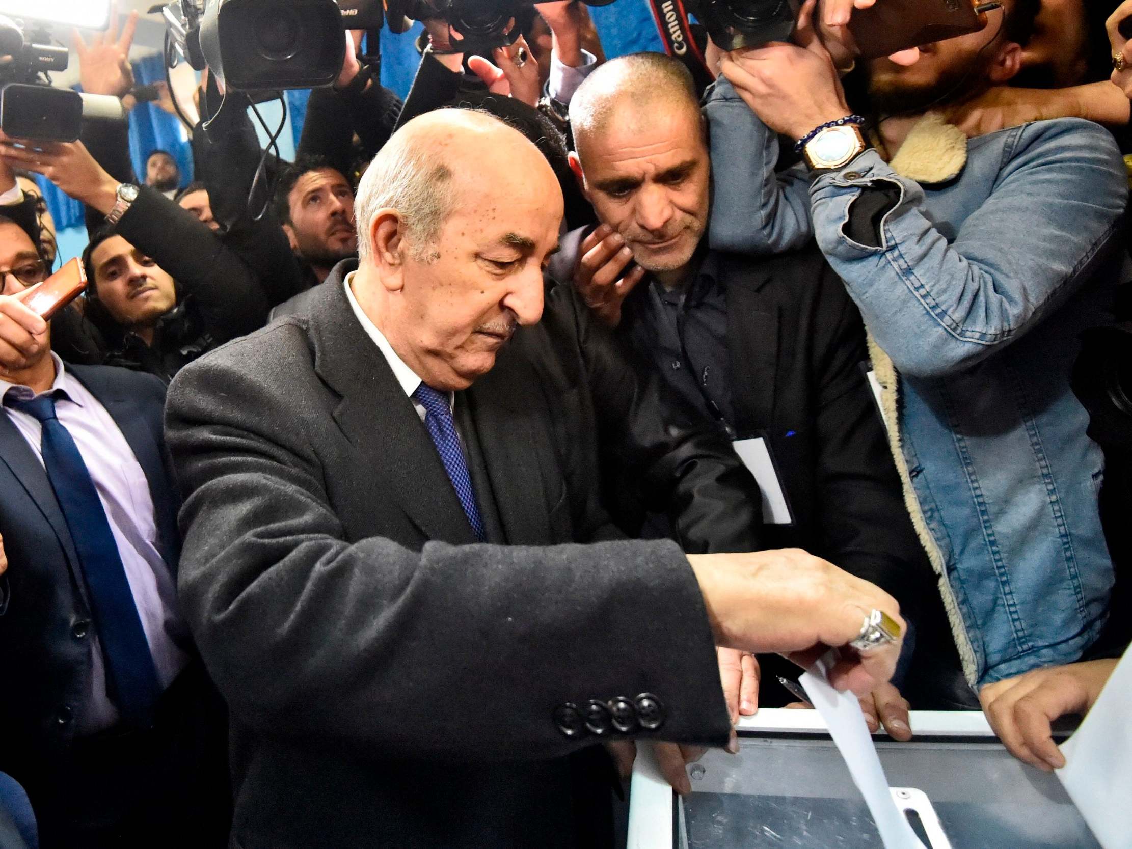 Algerian candidate Abdelmadjid Tebboune casts his vote during the election (AFP/Getty)