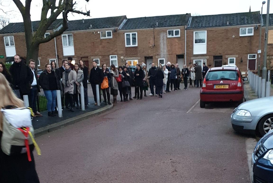 Voters queue up in Balham, London, to cast their ballots