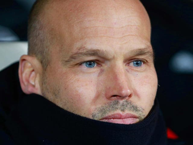 Freddie Ljungberg looks on as Arsenal topped their group