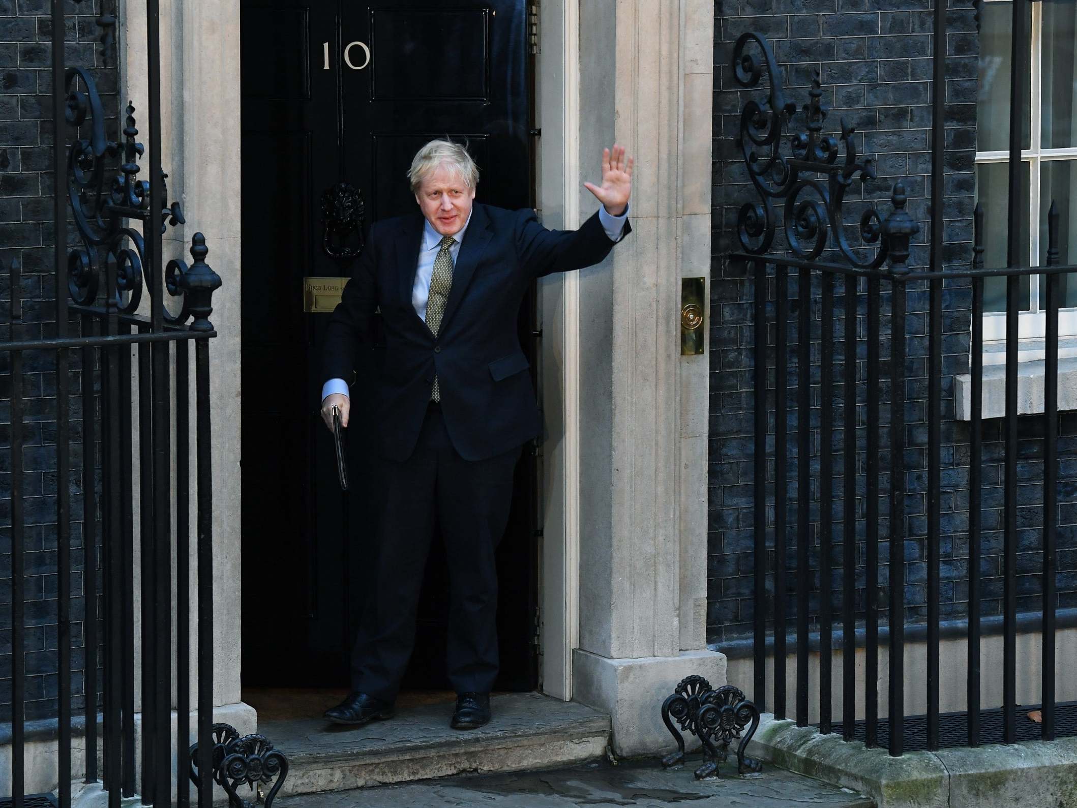 Johnson leaves No 10 to deliver a post-victory speech yesterday