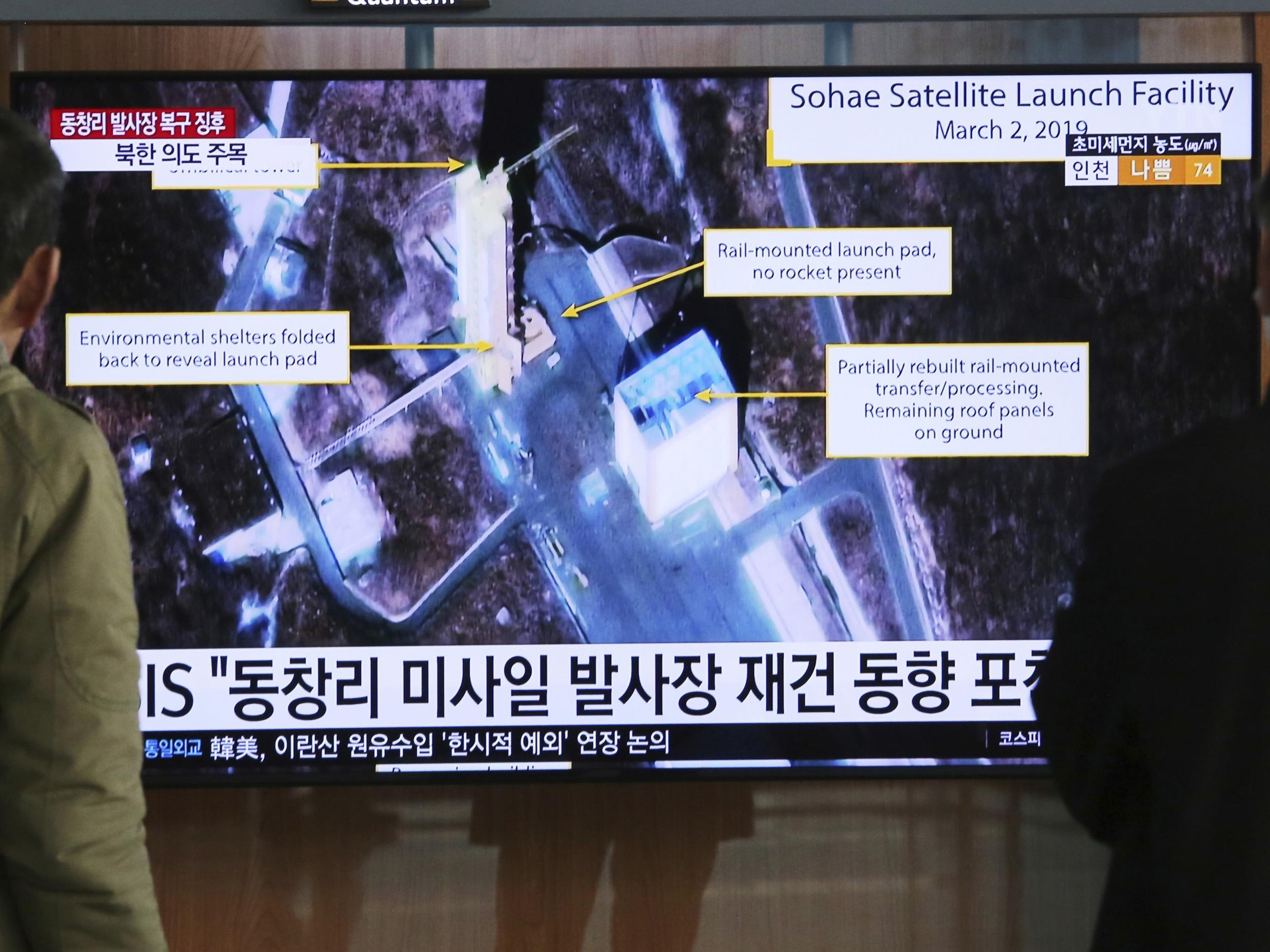 A TV screen in South Korea shows a satellite image of Sohae, North Korea's long-range missile testing site