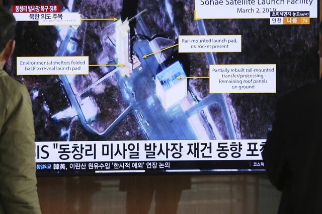 A TV screen in South Korea shows a satellite image of Sohae, North Korea's long-range missile testing site