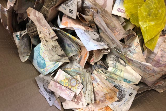 Some of the £20,000 in old notes and coins found inside the safe