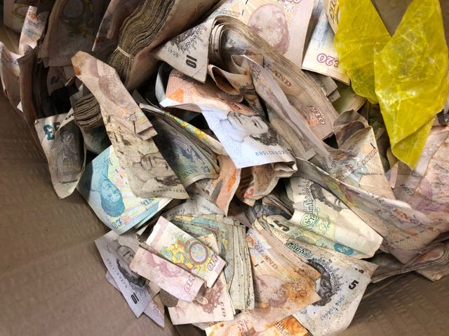 Some of the £20,000 in old notes and coins found inside the safe