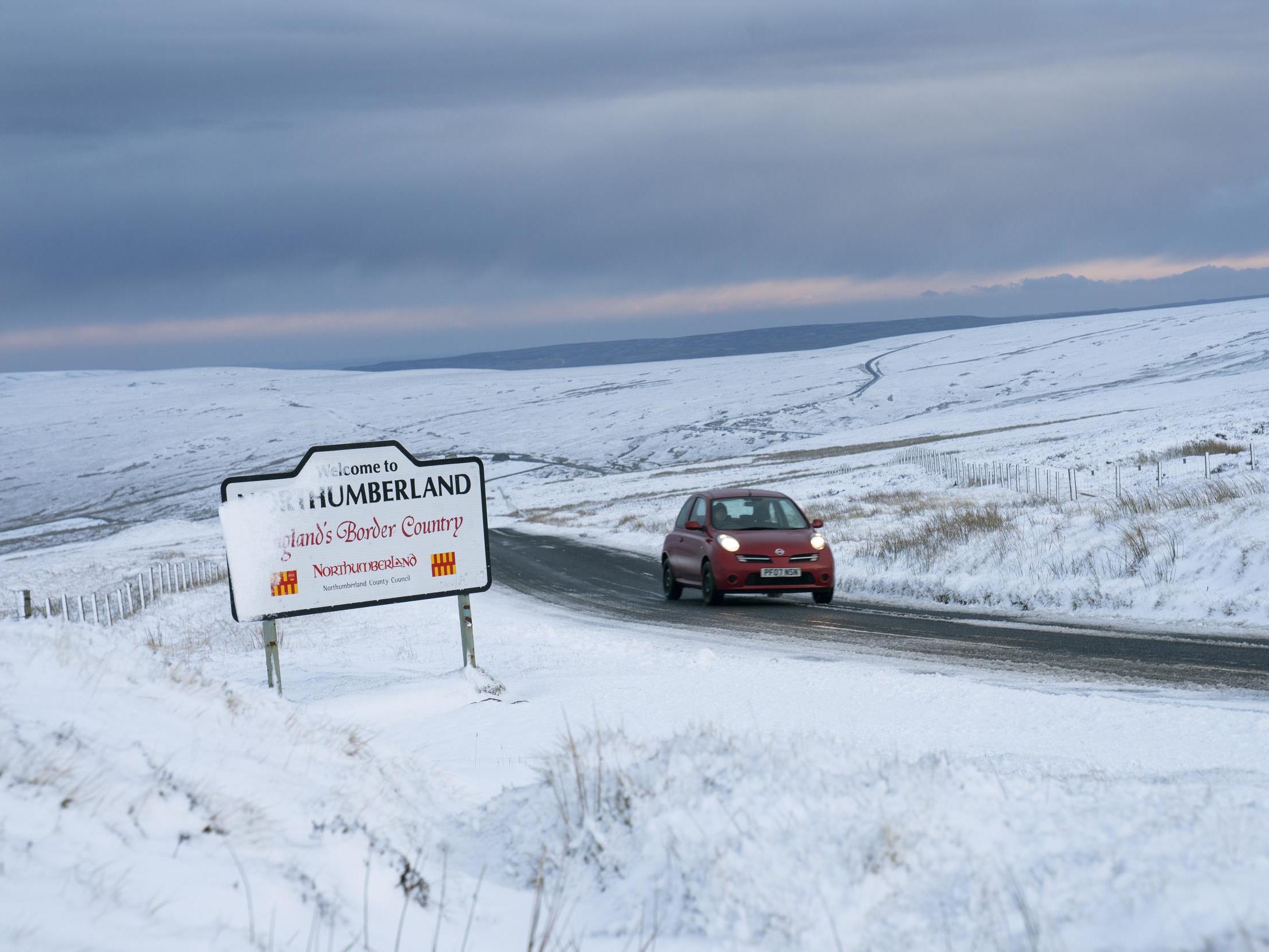 UK weather today: Heavy rain and snow across country as drivers stranded and flood warnings issued