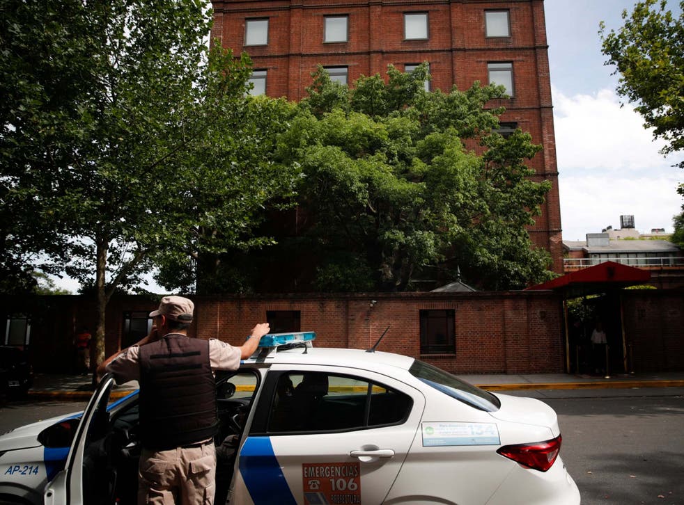 A police officer stands in front of the Faena Art Hotel in Buenos Aires, hours after Saturday’s attack