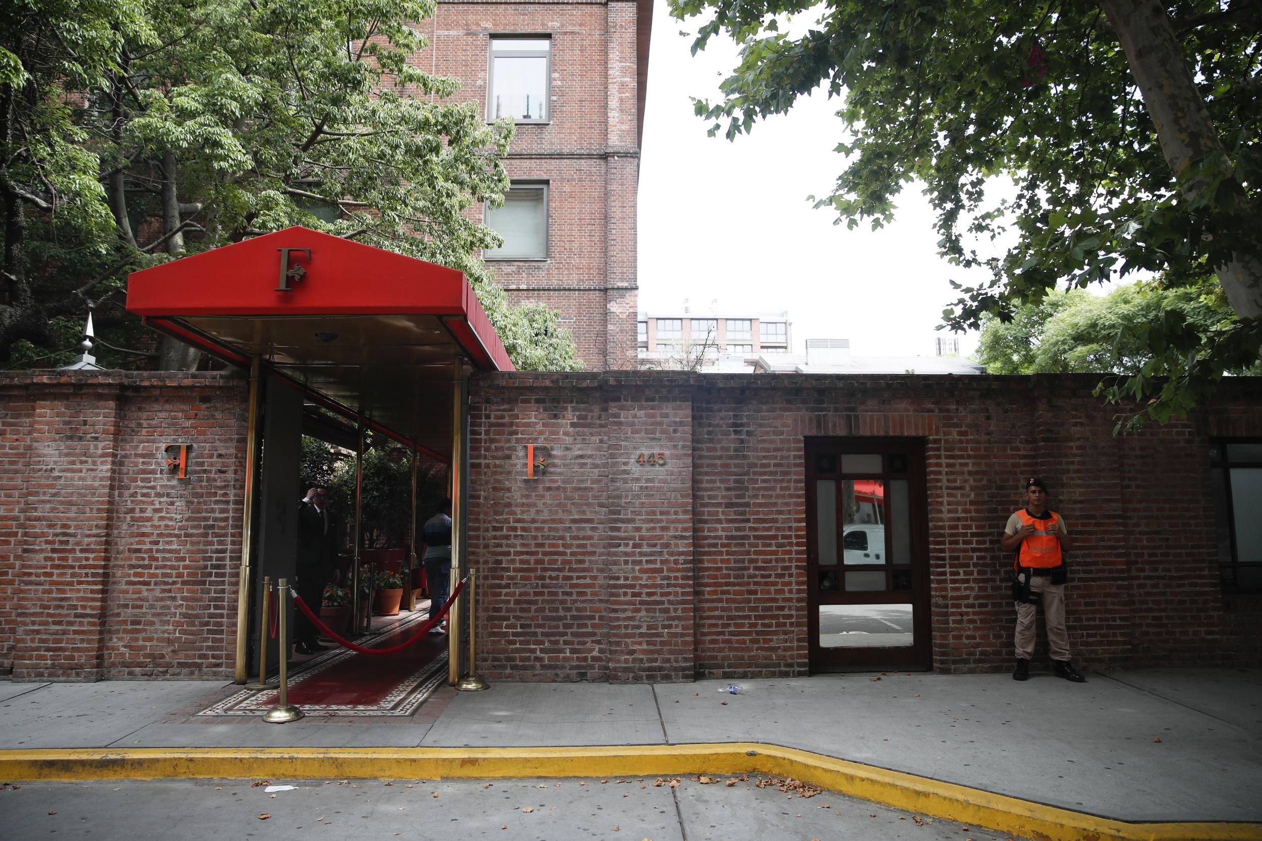 A naval official guards the entrance of the Faena Art Hotel in Buenos Aires, Argentina, hours after motorcycle robbers shot one British tourist dead and injured another, 14 December, 2019.