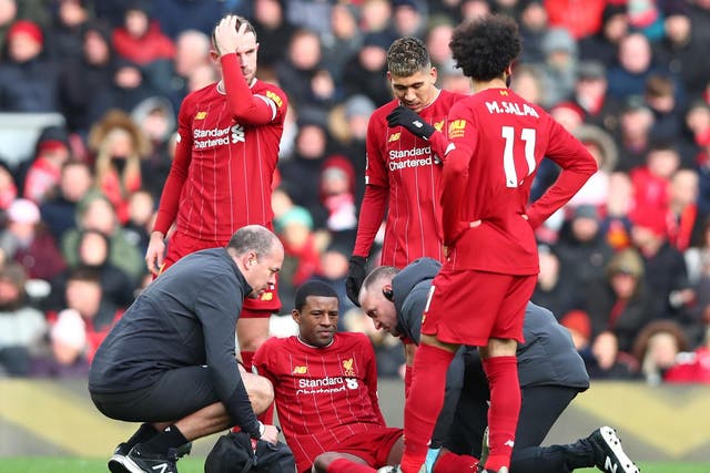 Georginio Wijnaldum receives treatment during Liverpool's win over Watford