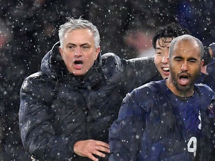 Mourinho celebrates with Spurs players after victory at Wolves