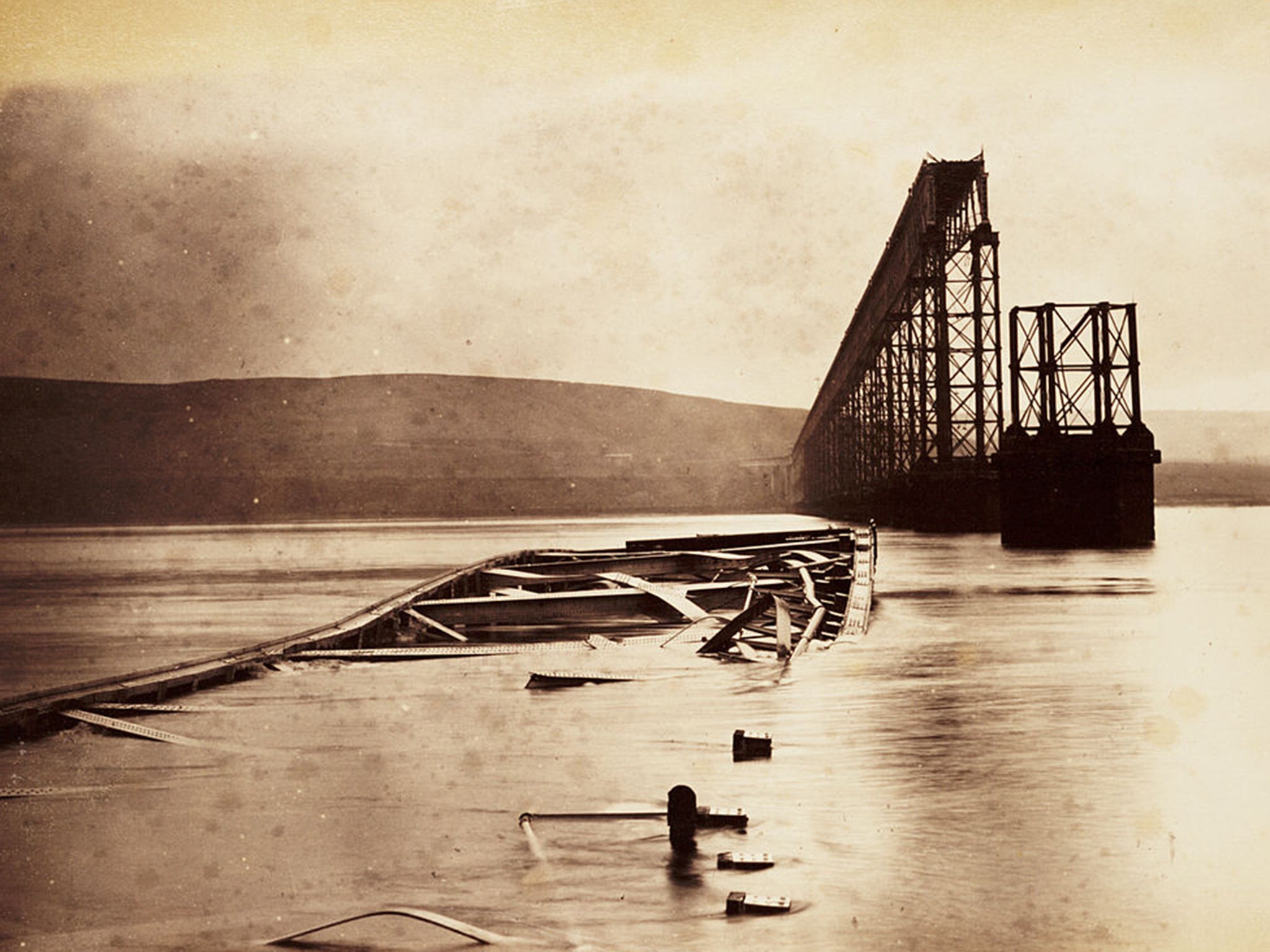 Aftermath: the central section of the bridge lies half-submerged in water