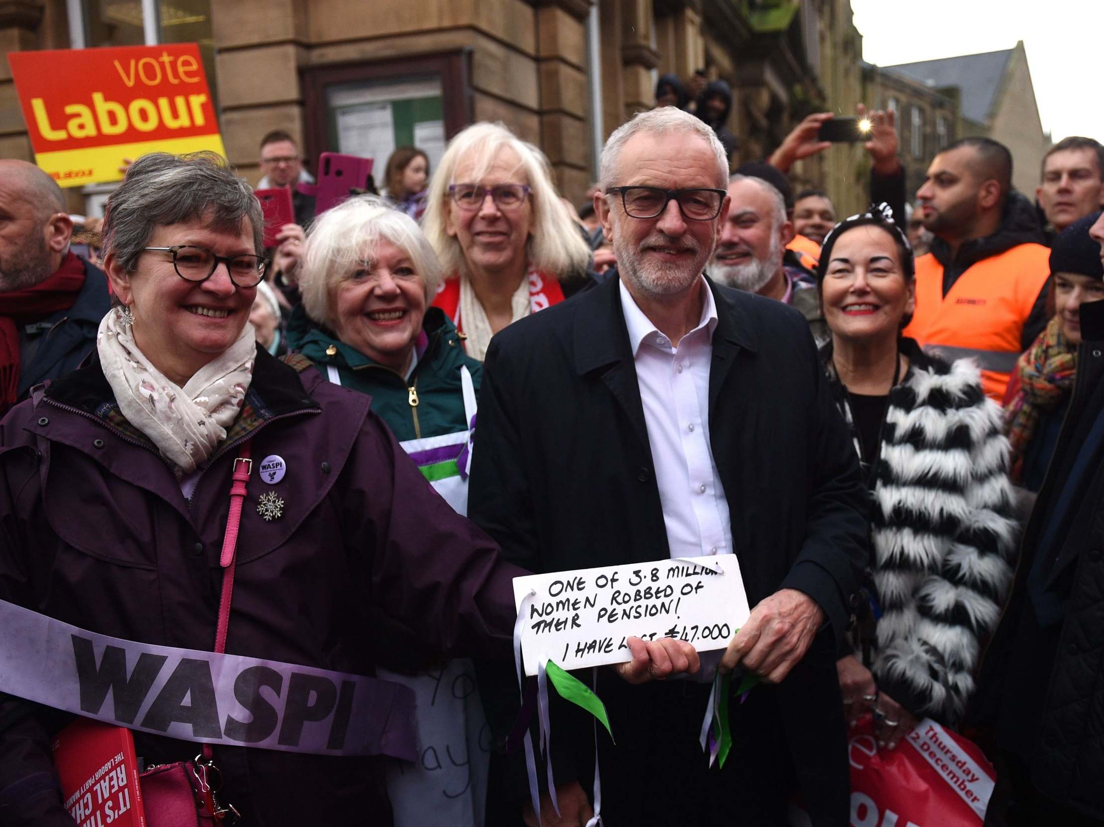 Jeremy Corbyn poses with supporters during a campaign event in "red wall" town of Nelson, northwest England